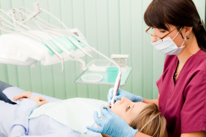 Dentist Examining Patient