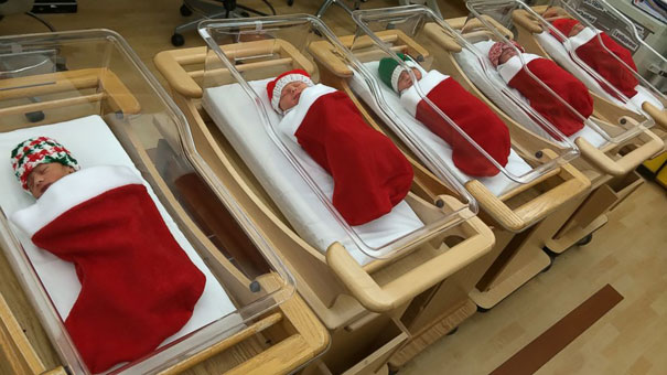 newborns at a hospital in christmas stockings