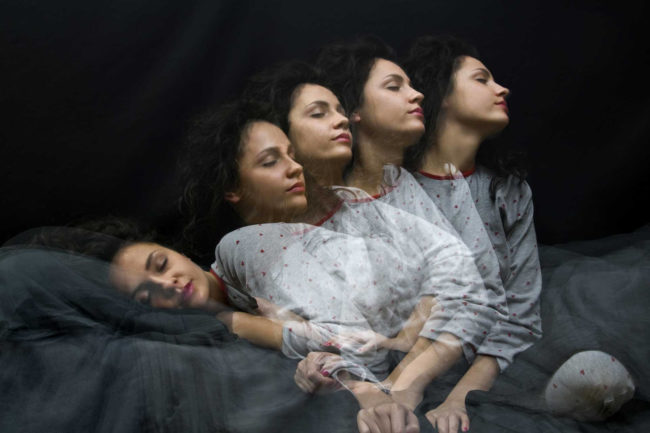 Multiple exposure of sleeping girl getting up or sleepwalking